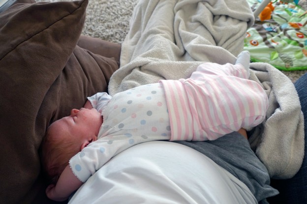 His favorite spot to sleep in his cousin Emmy's clothes